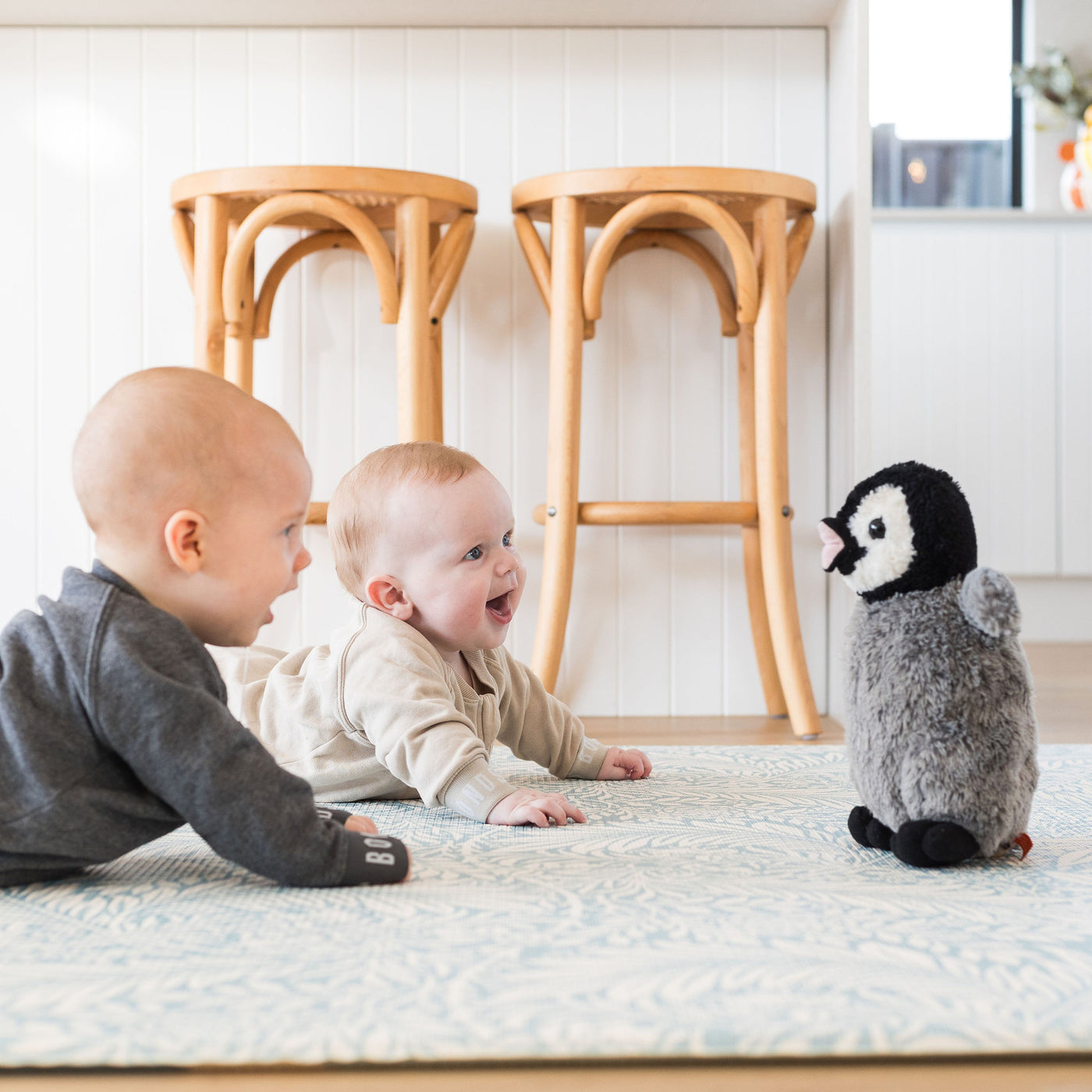 Babies playing on nature playmat