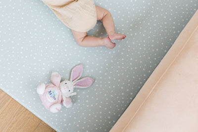 Baby feet on foam mat